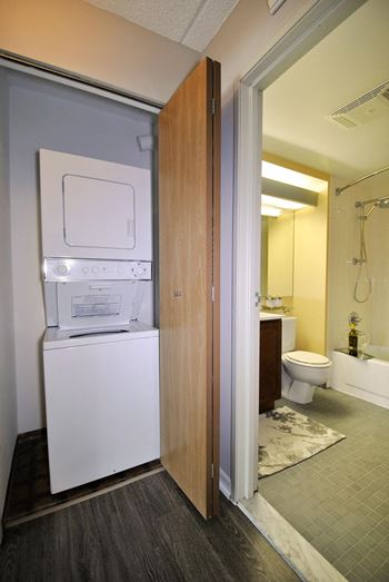 a laundry room with a washer and dryer in a hotel room
